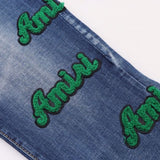 Amiri Jeans Blue Jeans Ripped Letter Embroidered Jeans