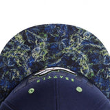 Trendy flat brimmed hat holding cigarette for sunshade