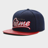 Trendy flat brimmed hat embroider la creme breathable mesh