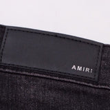 Amiri Jeans splashes ink and washes old ripped slim jeans