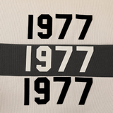 Fear of God Essentials 1977 Rugby Wheat Printed Long-Sleeved Polo Shirt